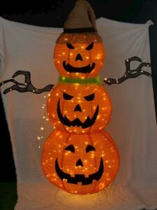 Three pumpkins with hats